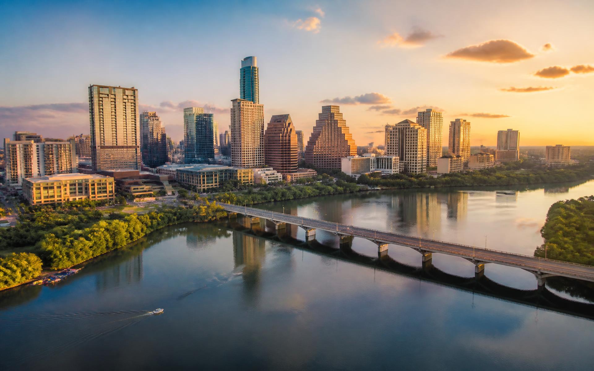 Aerial view of the Austin skyline at sunset over Lady Bird Lake